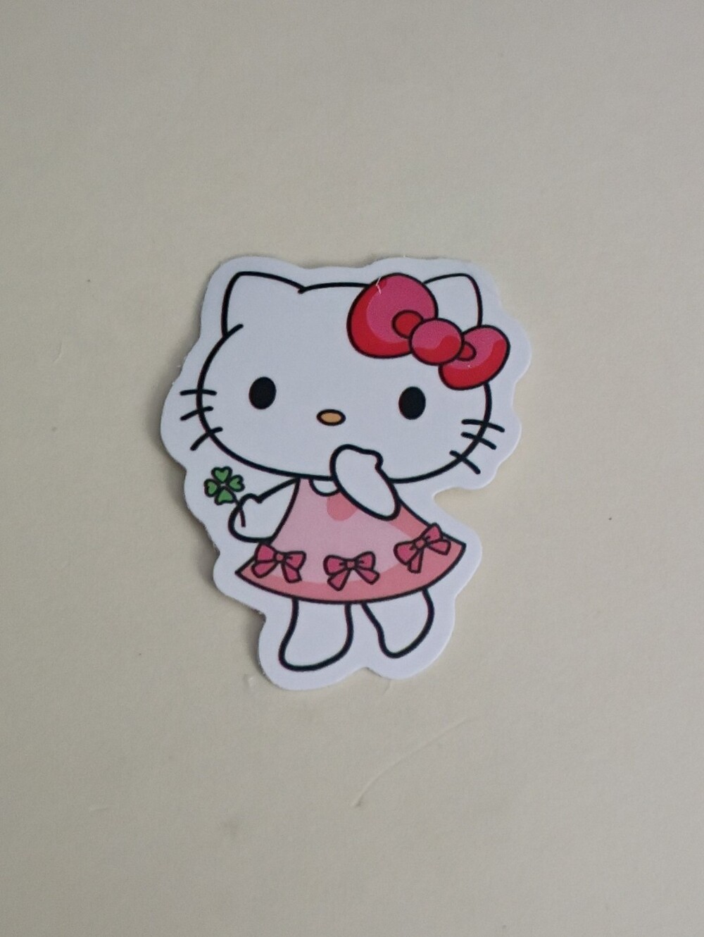 10/$10 Stickers - Hello Kitty Red Bow Pink Dress w/ Bows Holding 4 Leaf Clover